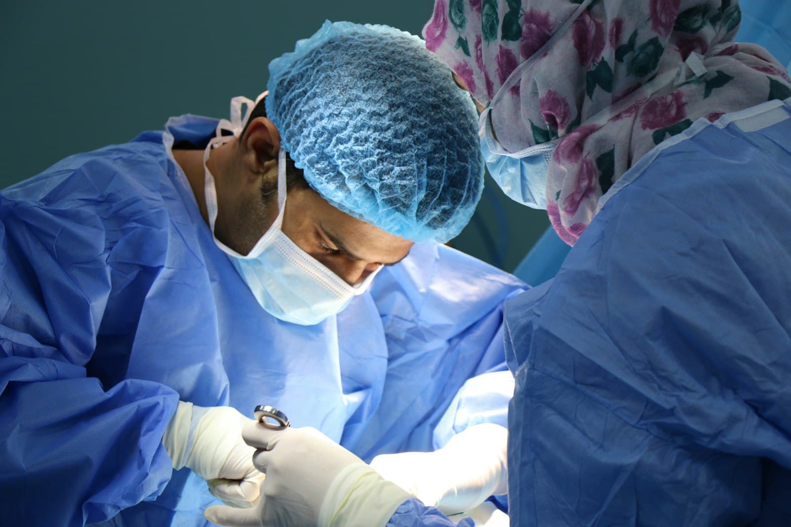 Doctor and coordinator reviewing patient medical reports